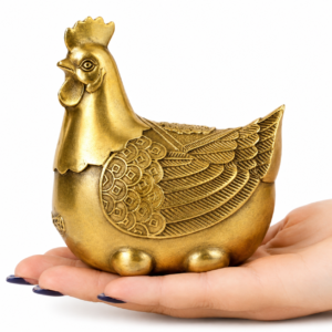 Handcrafted brass Feng Shui hen ornament with intricate feather engravings and antique gold finish for home and office décor.