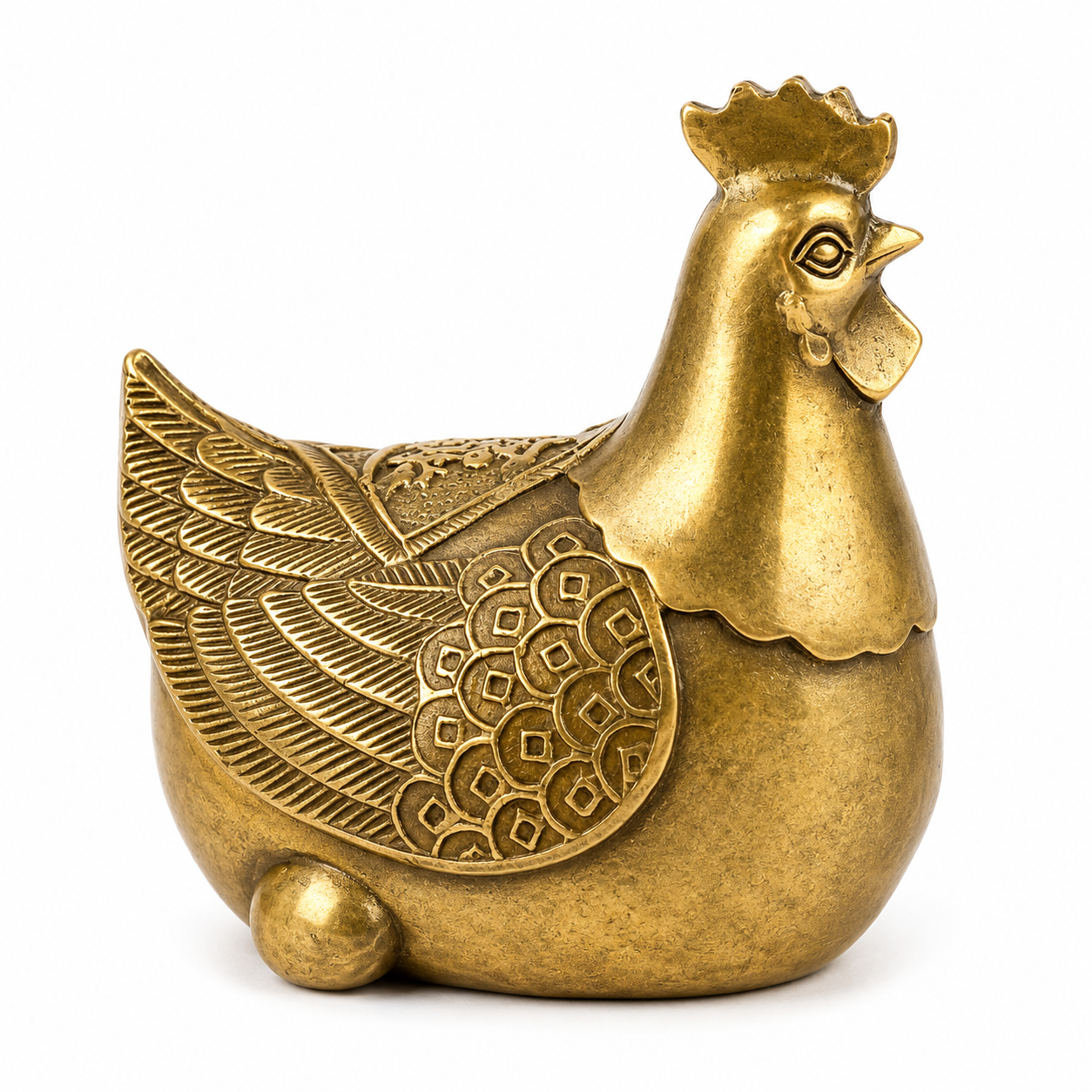 Brass Feng Shui Hen Handcrafted brass Feng Shui hen ornament with intricate feather engravings and antique gold finish for home and office décor.
