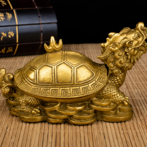 Handcrafted brass Dragon Turtle Feng Shui ornament with intricate carvings, antique gold finish, and traditional Chinese craftsmanship for home and office décor.